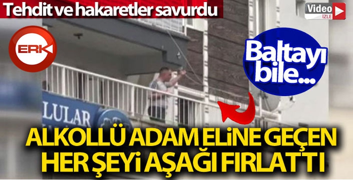 Alkollü bir kişi, balkondan esnafa balta fırlattı