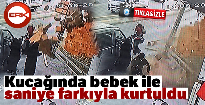 Kucağında bebek ile saniye farkıyla kurtuldu