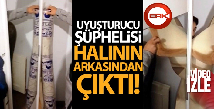 Uyuşturucu şüphelisi halının arkasından çıktı